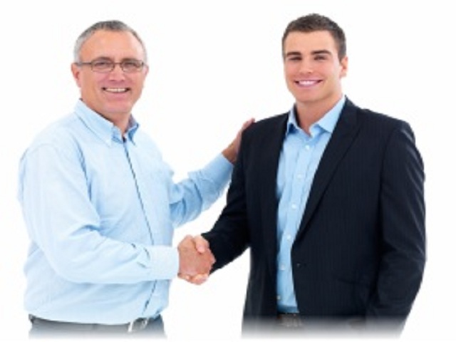 Portrait of two businessmen shaking hands against white background